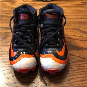 Boys orange Nike baseball cleats